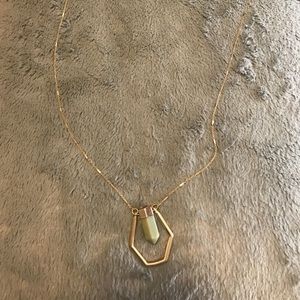 Pendant necklace. Green stone, gold chain.